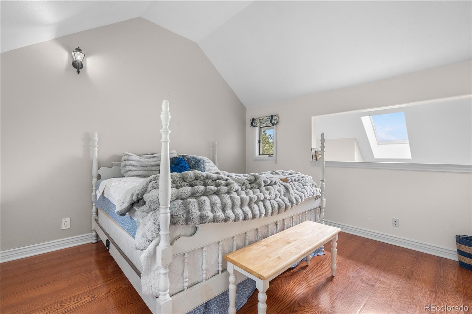 137 Bob Cat Trail Bailey, CO 80421 - Photo 17 of 46 a bedroom with bed and a window