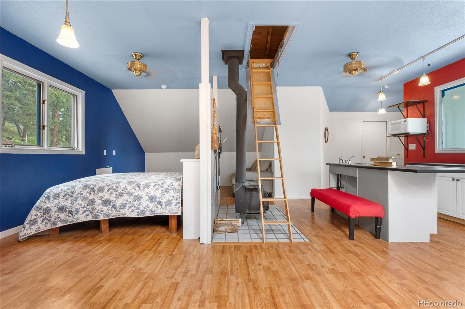 137 Bob Cat Trail Bailey, CO 80421 - Photo 27 of 46 a living room with furniture and wooden floor