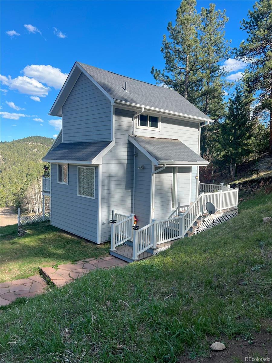 137 Bob Cat Trail Bailey, CO 80421 - Photo 36 of 46 a view of a house with a yard and sitting area