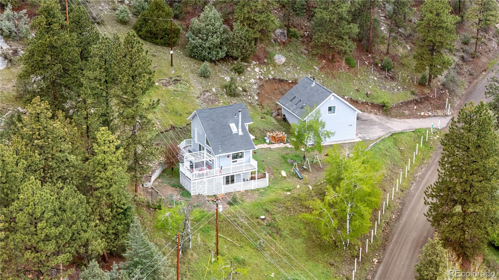 137 Bob Cat Trail Bailey, CO 80421 - Photo 41 of 46 an aerial view of a house with a yard