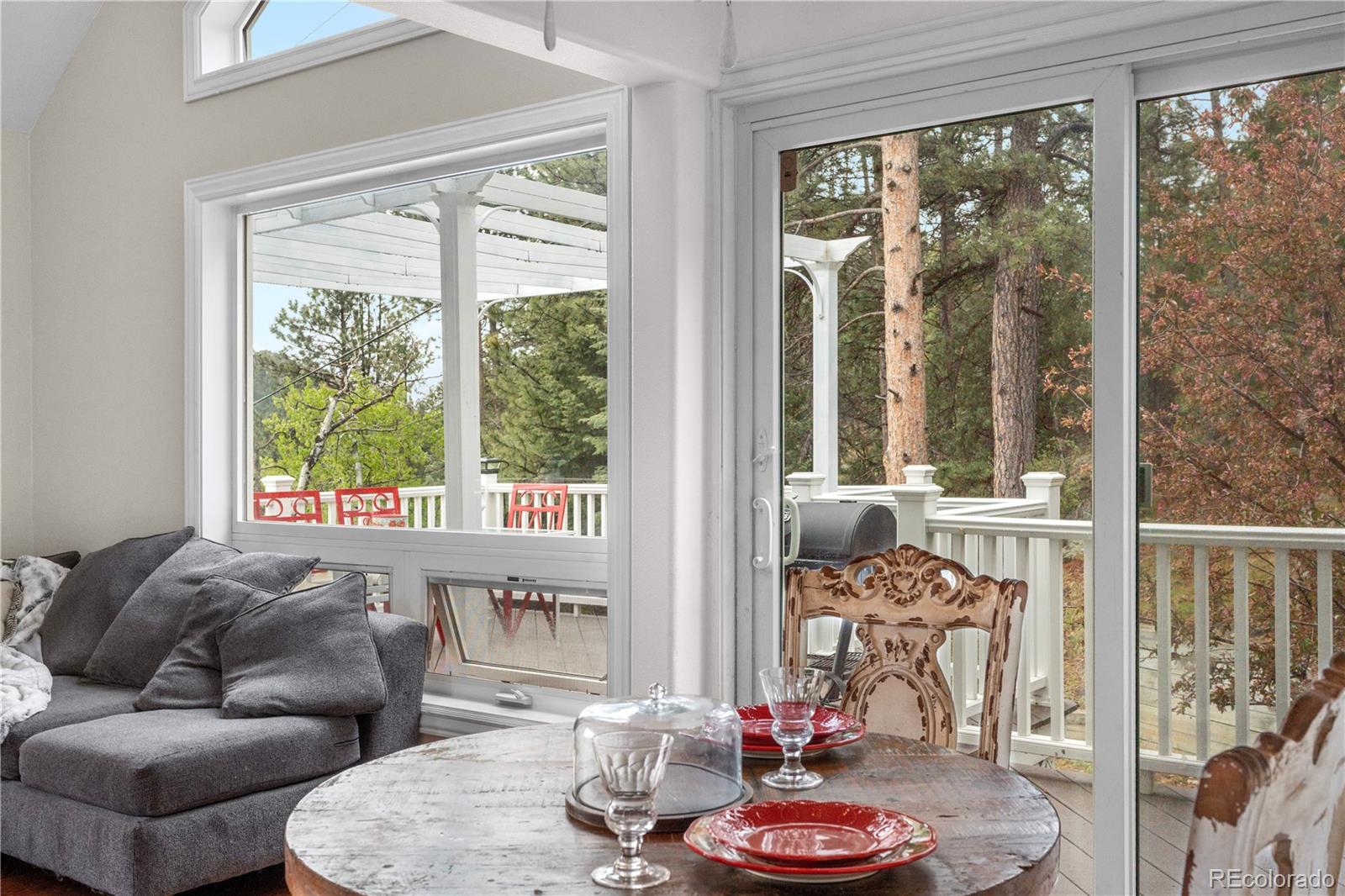 137 Bob Cat Trail Bailey, CO 80421 - Photo 6 of 46 a living room with furniture and a large window