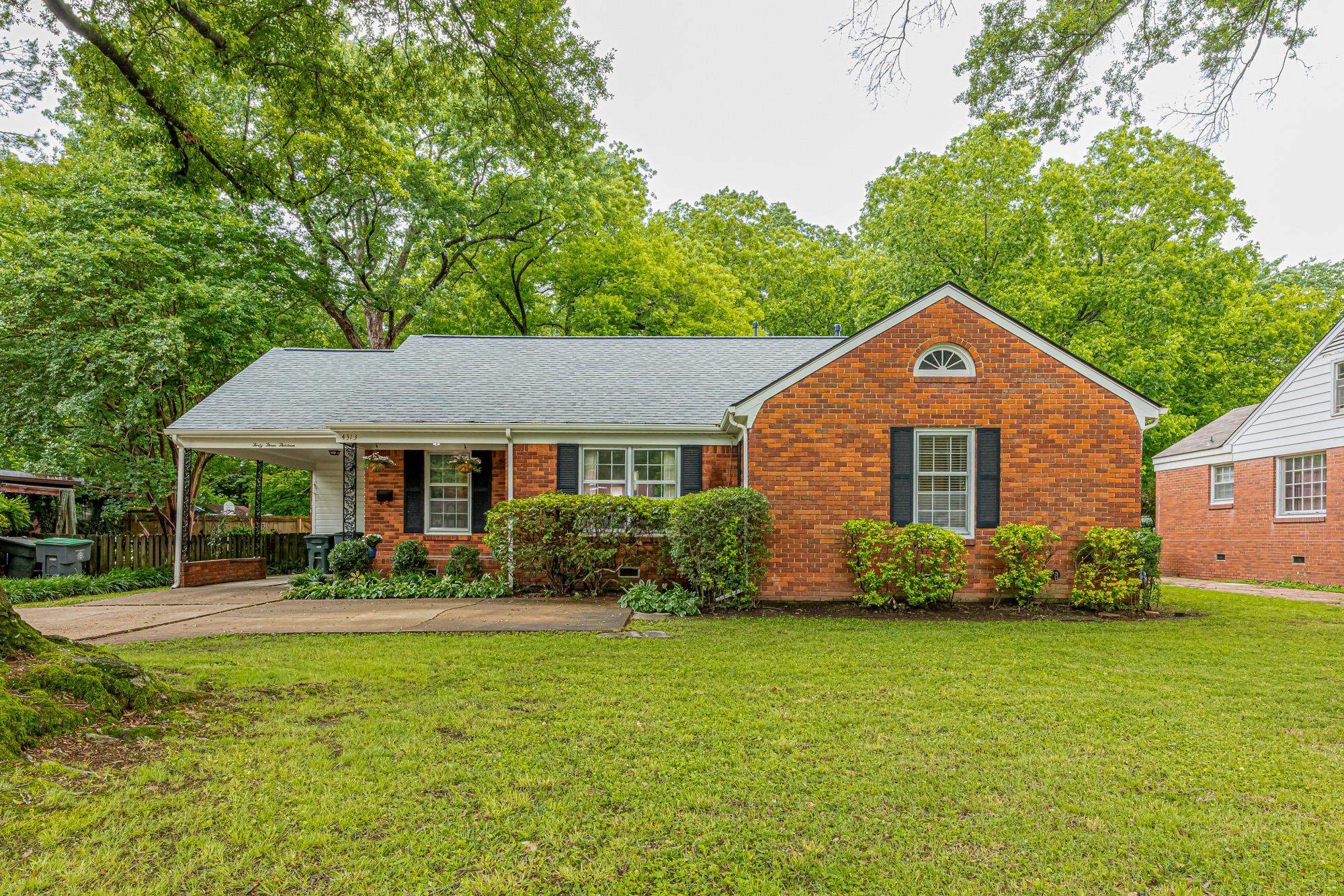 4313 Rhodes Avenue Memphis, TN 38111 - Photo 1 of 25 a front view of a house with garden