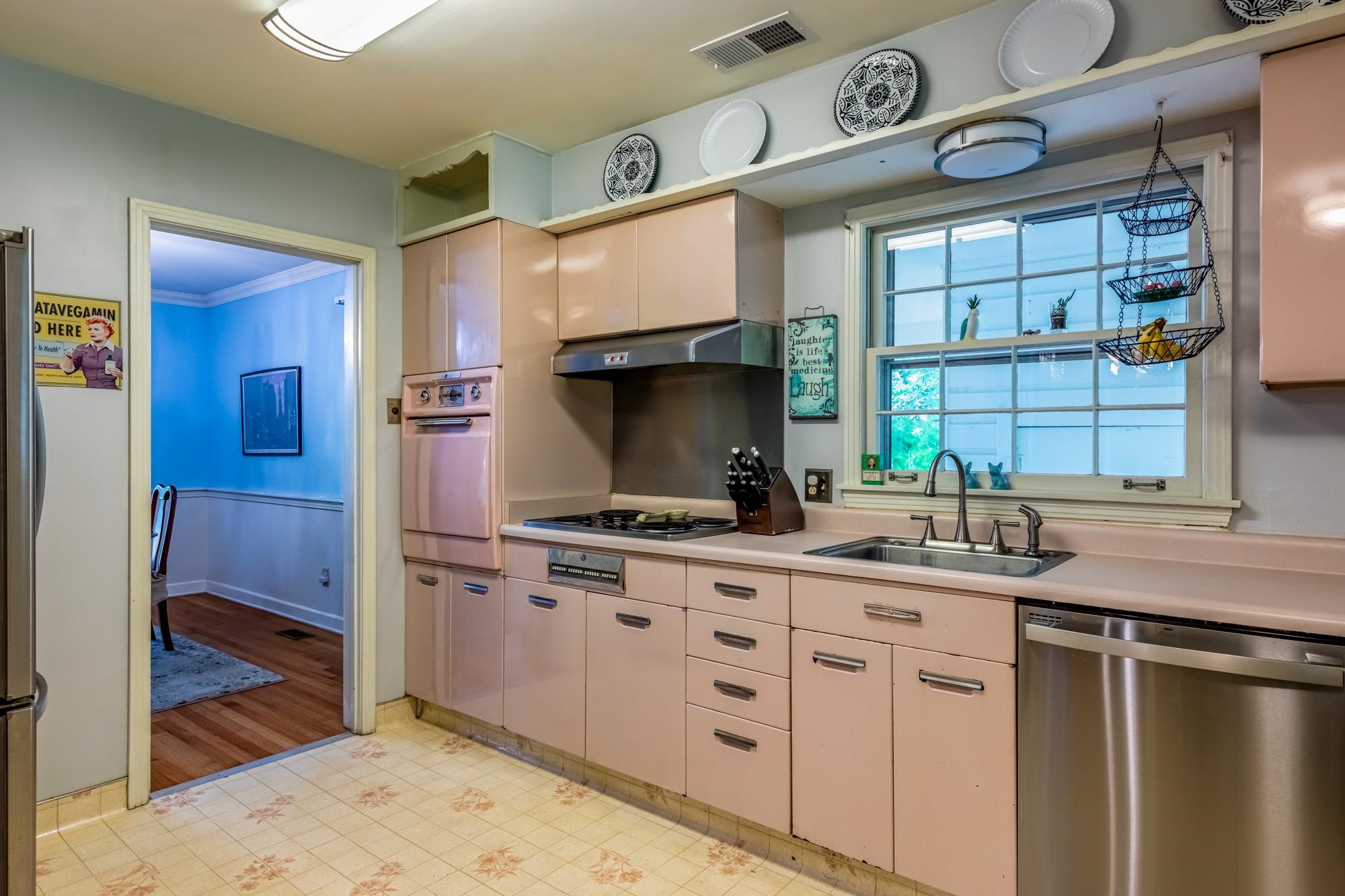 4313 Rhodes Avenue Memphis, TN 38111 - Photo 13 of 25 a kitchen with stainless steel appliances a sink and a stove