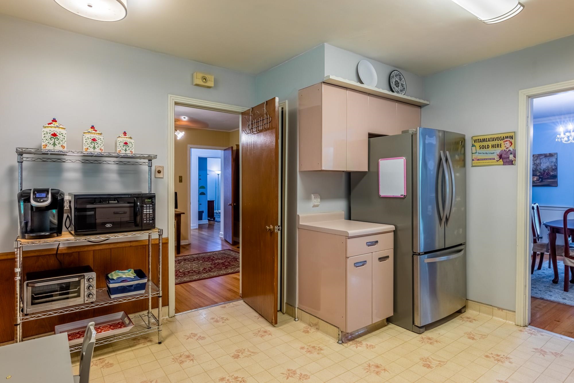 4313 Rhodes Avenue Memphis, TN 38111 - Photo 14 of 25 a kitchen with stainless steel appliances granite countertop a refrigerator and a stove