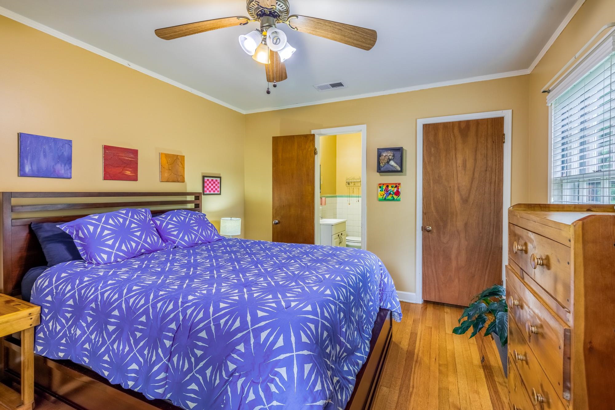 4313 Rhodes Avenue Memphis, TN 38111 - Photo 15 of 25 a bedroom with a bed and wooden floor