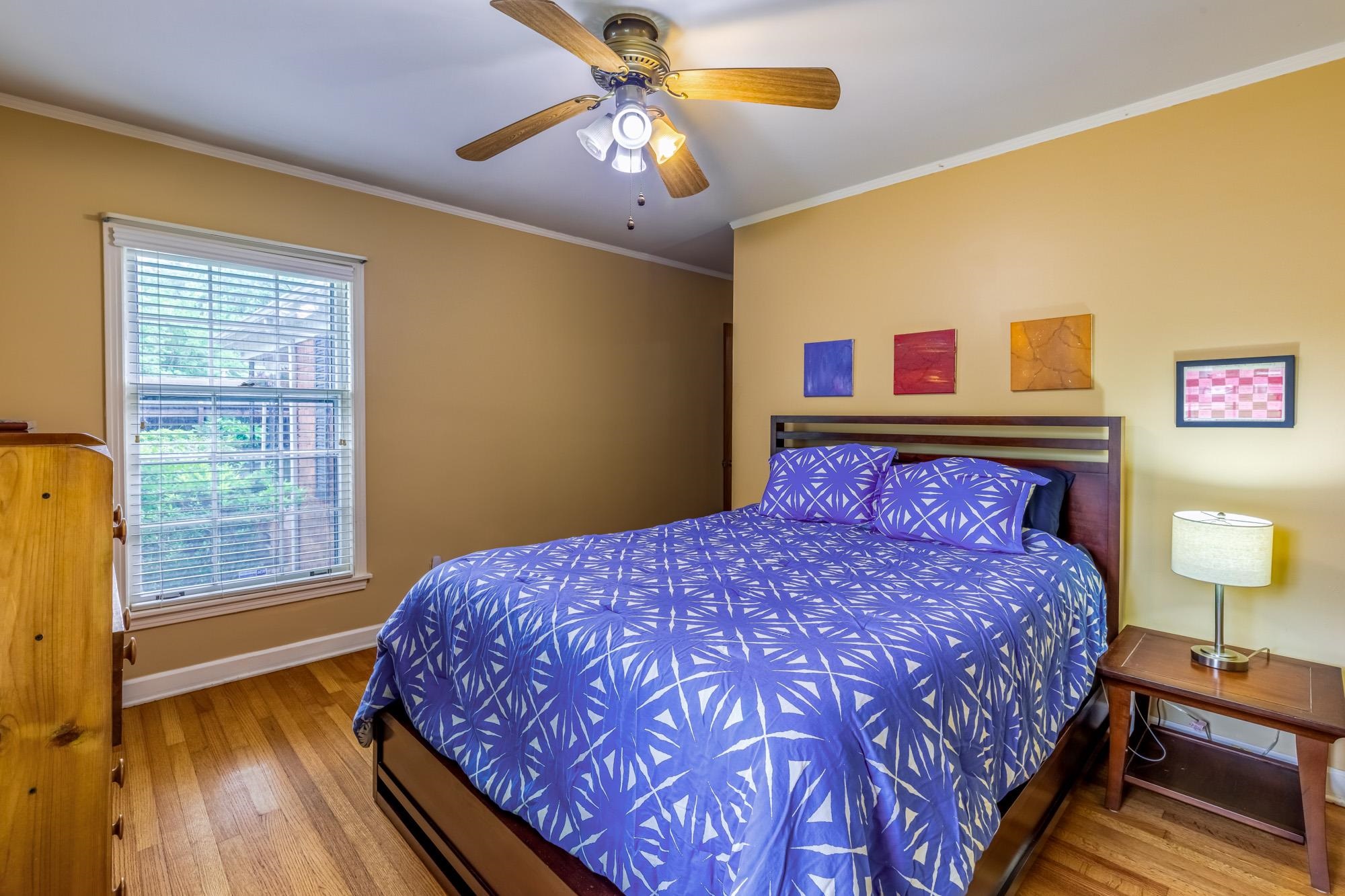4313 Rhodes Avenue Memphis, TN 38111 - Photo 16 of 25 a bedroom with a bed and a lamp