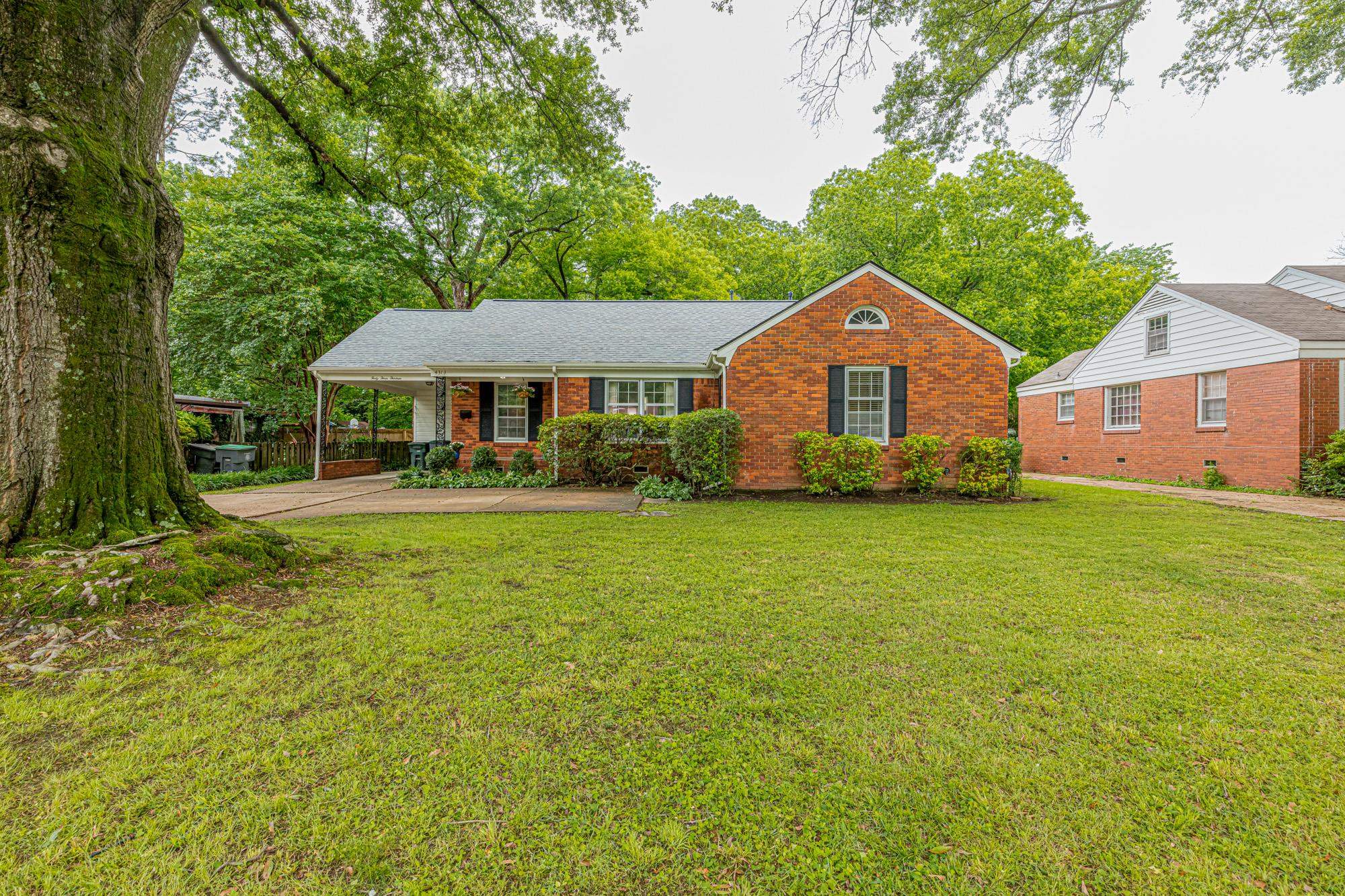 4313 Rhodes Avenue Memphis, TN 38111 - Photo 2 of 25 a front view of a house with garden