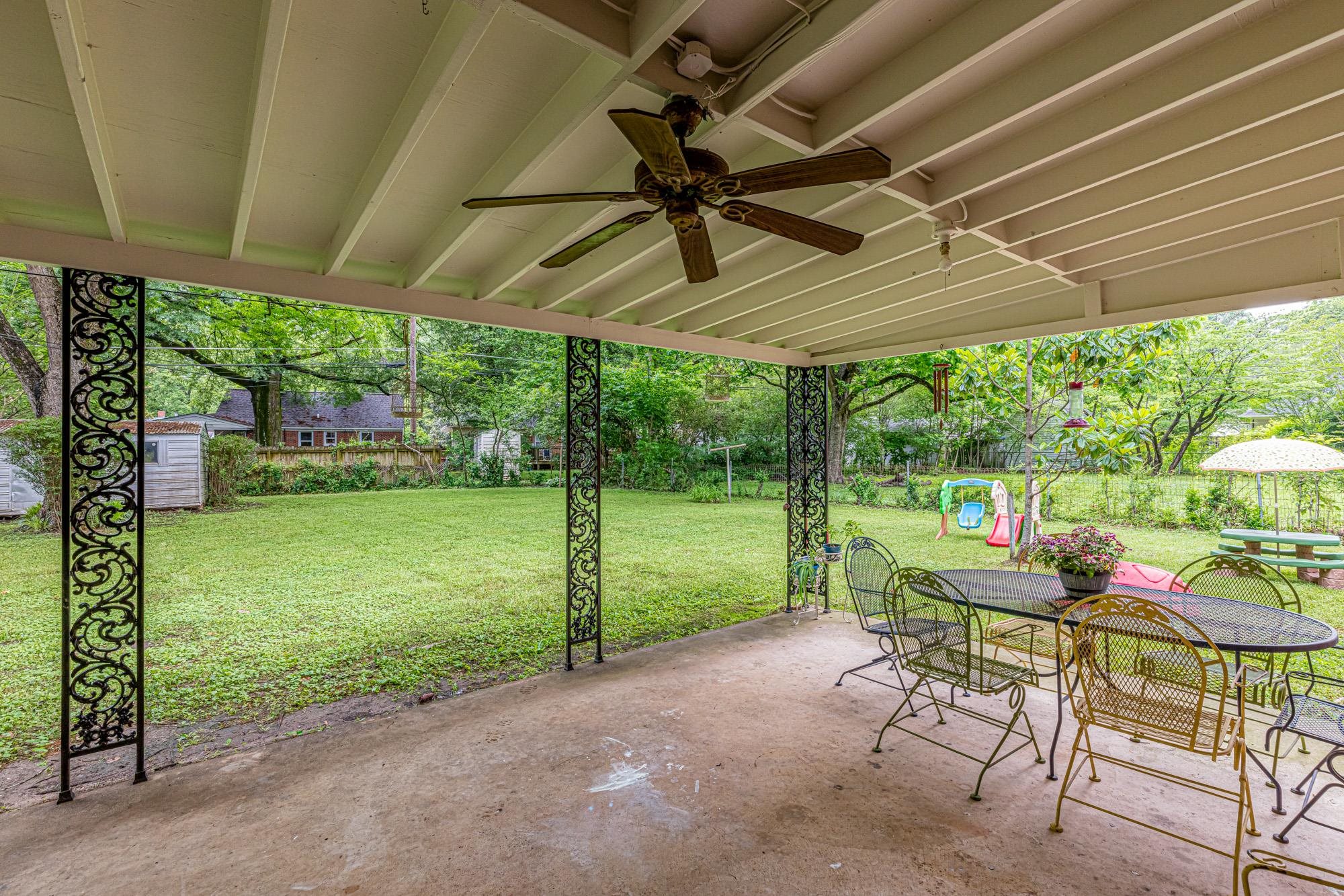 4313 Rhodes Avenue Memphis, TN 38111 - Photo 23 of 25 a patio with yard table and chairs