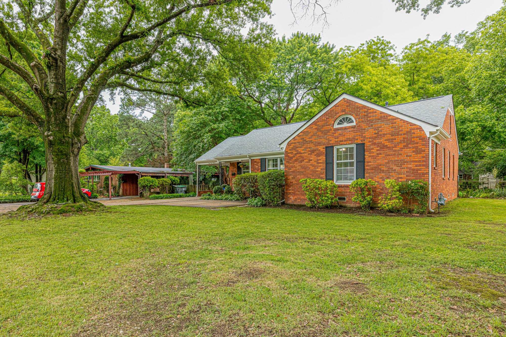 4313 Rhodes Avenue Memphis, TN 38111 - Photo 3 of 25 a front view of a house with a garden