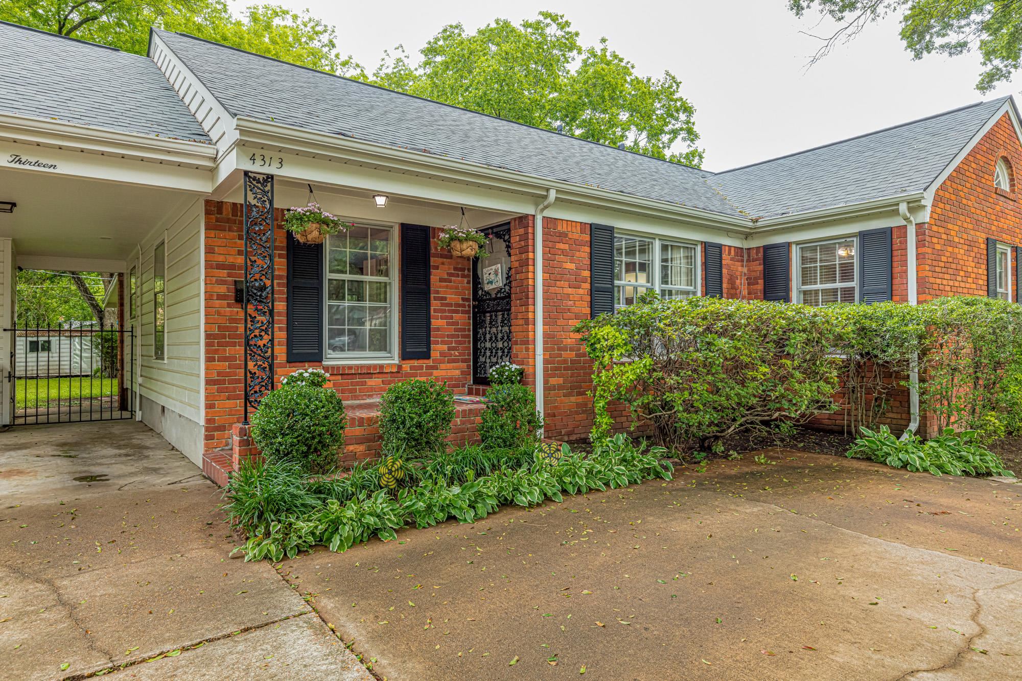 4313 Rhodes Avenue Memphis, TN 38111 - Photo 5 of 25 a front view of a house with garden