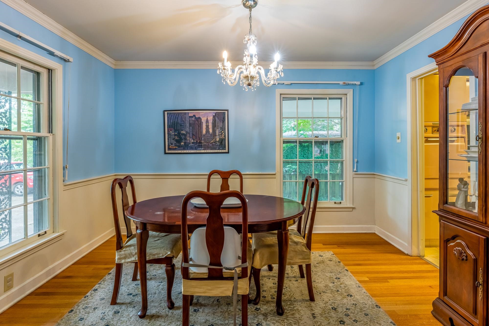 4313 Rhodes Avenue Memphis, TN 38111 - Photo 10 of 25 a view of a dining room with furniture a chandelier and wooden floor