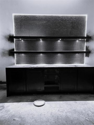 a large kitchen with a large counter space a sink and appliances