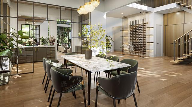 a view of a dining room with furniture and chandelier