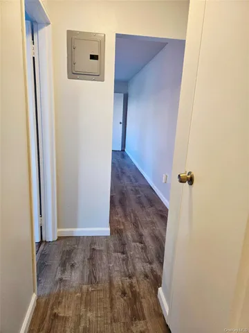 a view of a livingroom with wooden floor