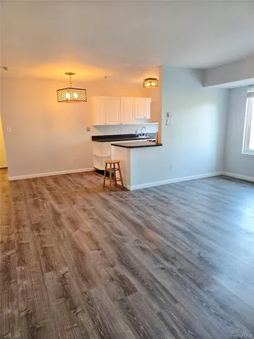 a view of workspace with wooden floor