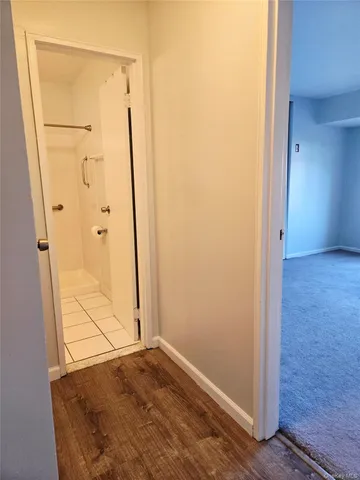 an empty room with wooden door