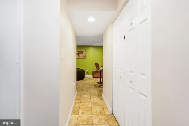 a hallway with a dining table and a hallway