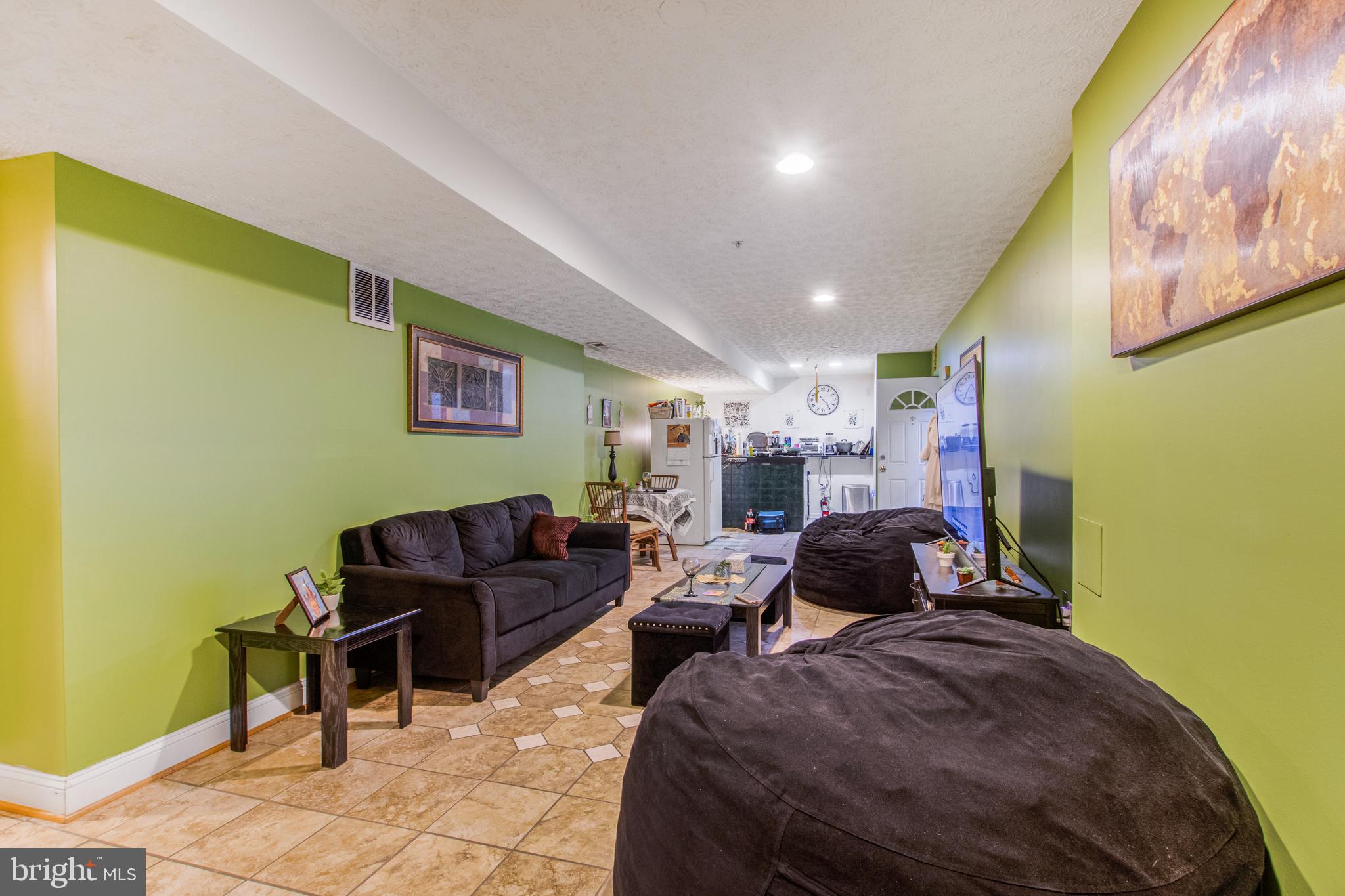 11809 Old Fort Road Fort Washington, MD 20744 - Photo 16 of 40 a living room with furniture and a couch