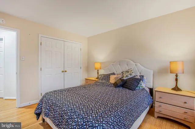 a bedroom with a bed and a lamp