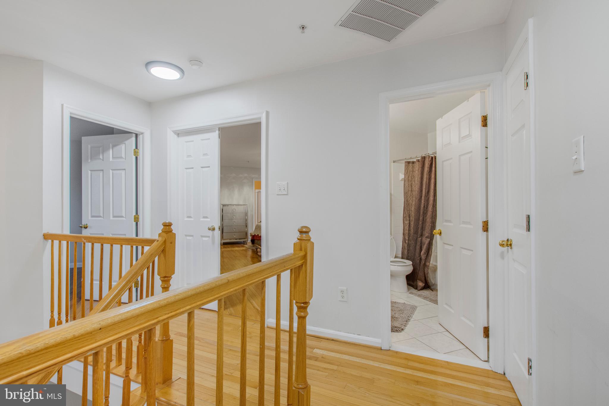 11809 Old Fort Road Fort Washington, MD 20744 - Photo 23 of 40 a view of a hallway with windows and stairs