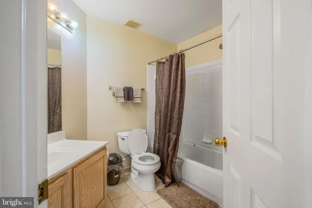 a bathroom with a toilet a sink and bathtub