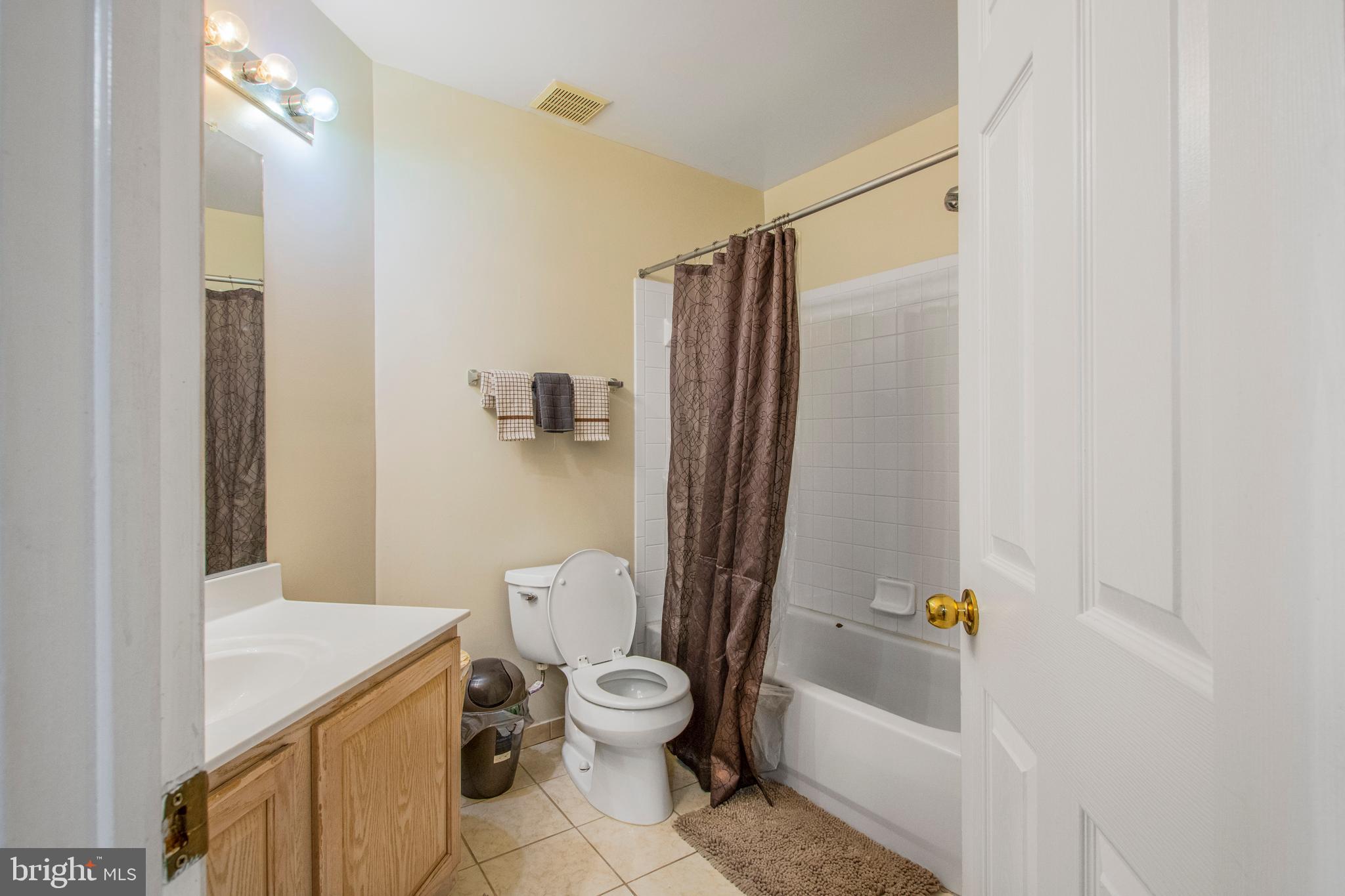 11809 Old Fort Road Fort Washington, MD 20744 - Photo 24 of 40 a bathroom with a toilet a sink and bathtub