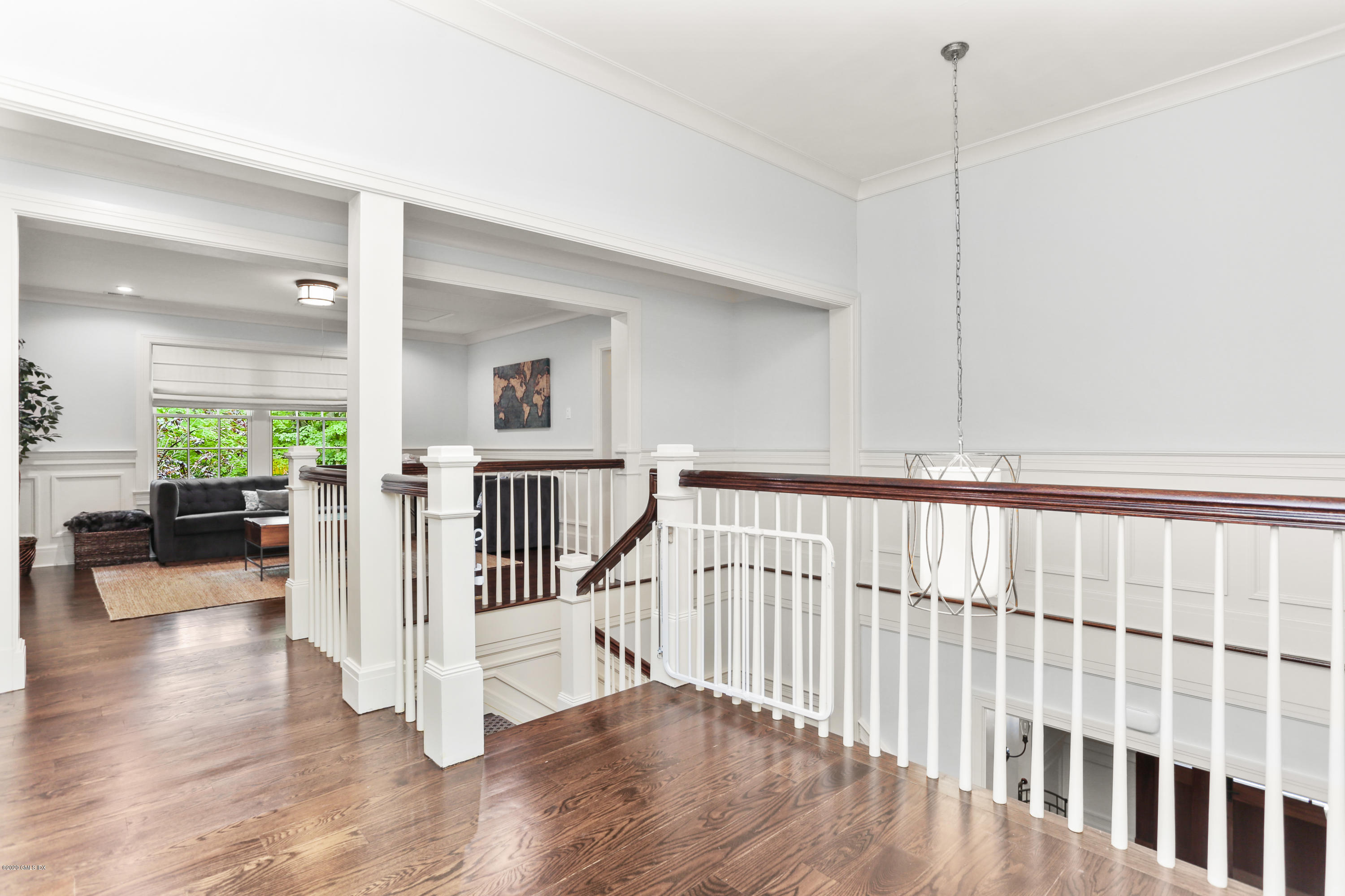 125 Cat Rock Road Cos Cob, CT 06807 - Photo 14 of 33 a view of staircase with wooden floor and a window