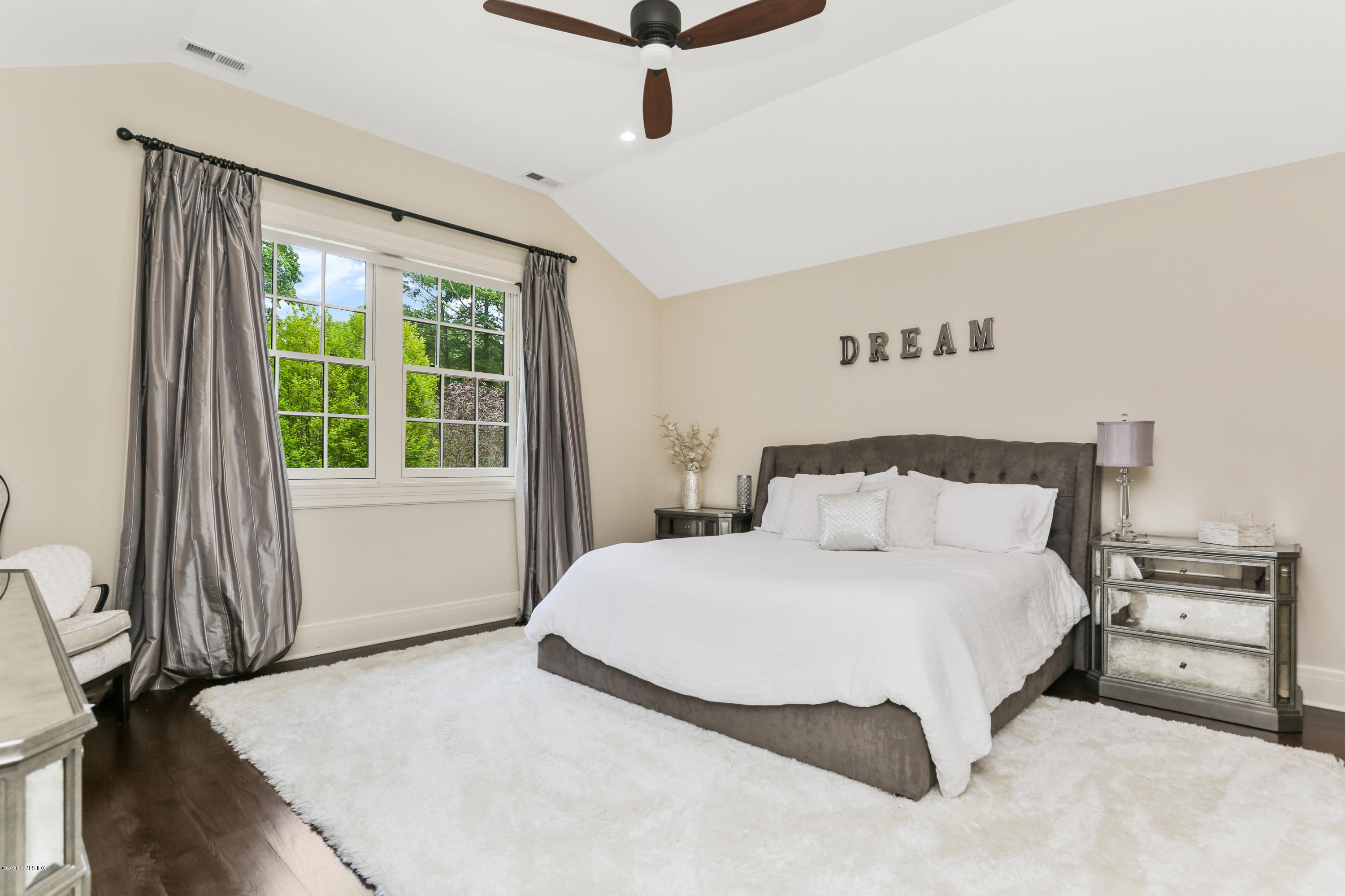 125 Cat Rock Road Cos Cob, CT 06807 - Photo 17 of 33 a bedroom with a bed and a window