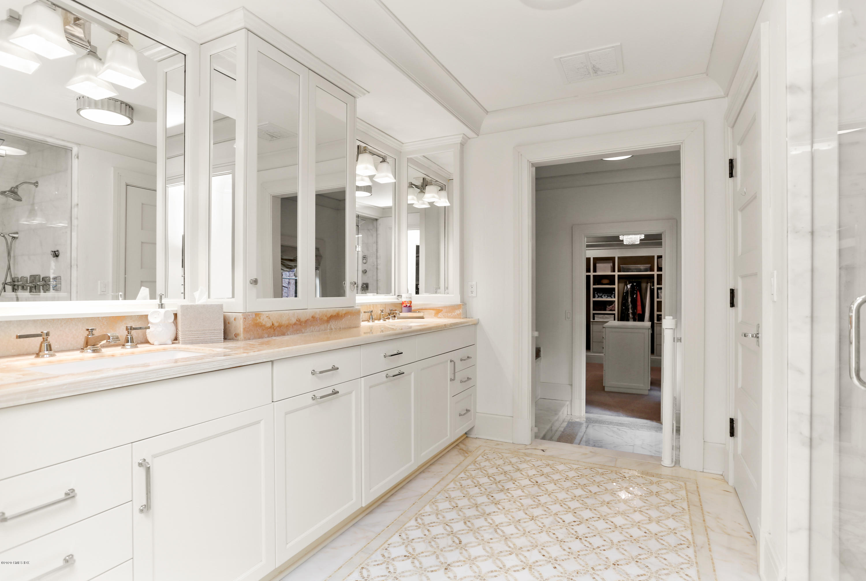 125 Cat Rock Road Cos Cob, CT 06807 - Photo 20 of 33 a spacious bathroom with a sink and a mirror