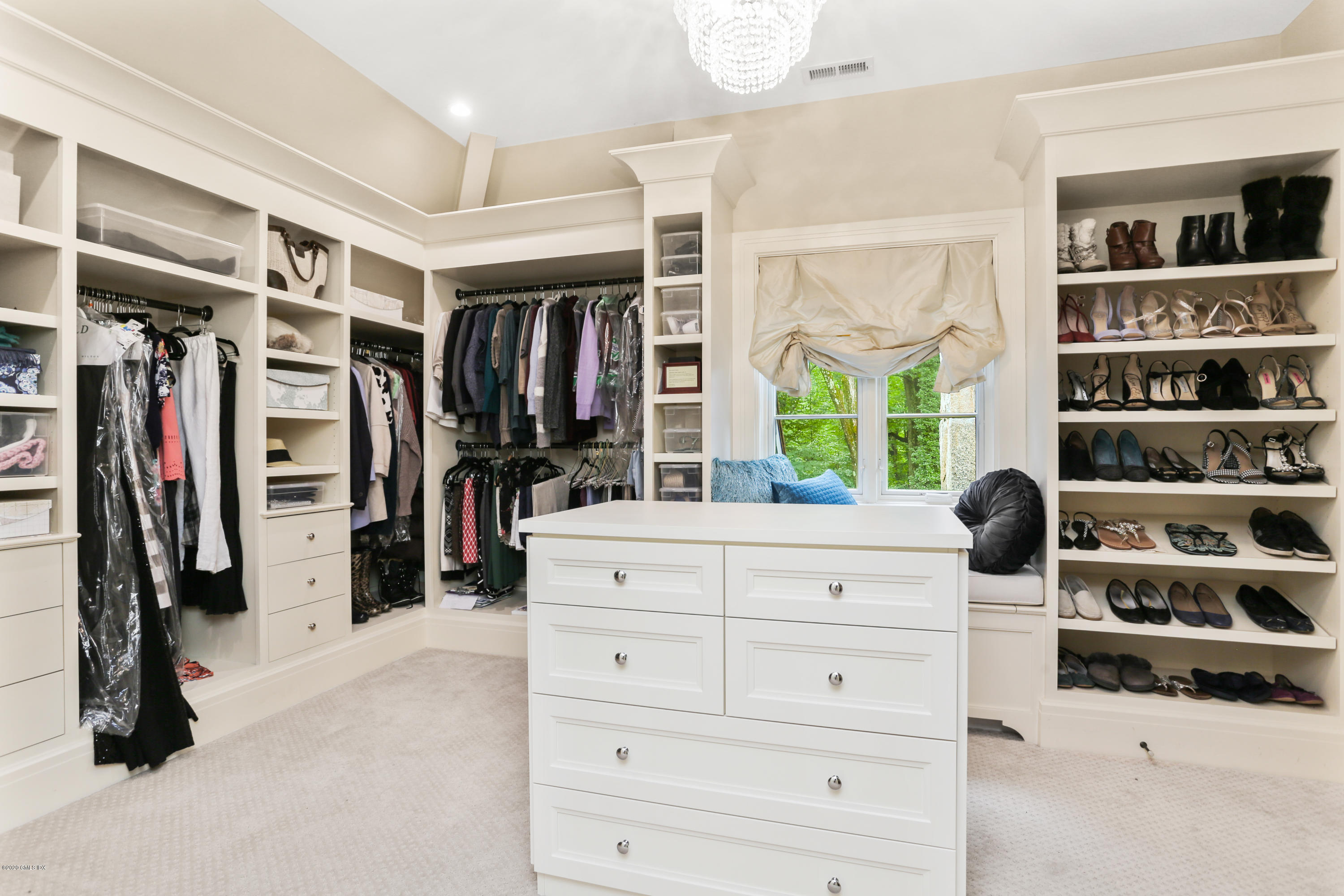 125 Cat Rock Road Cos Cob, CT 06807 - Photo 21 of 33 a view of walk in closet with clothes and shoes