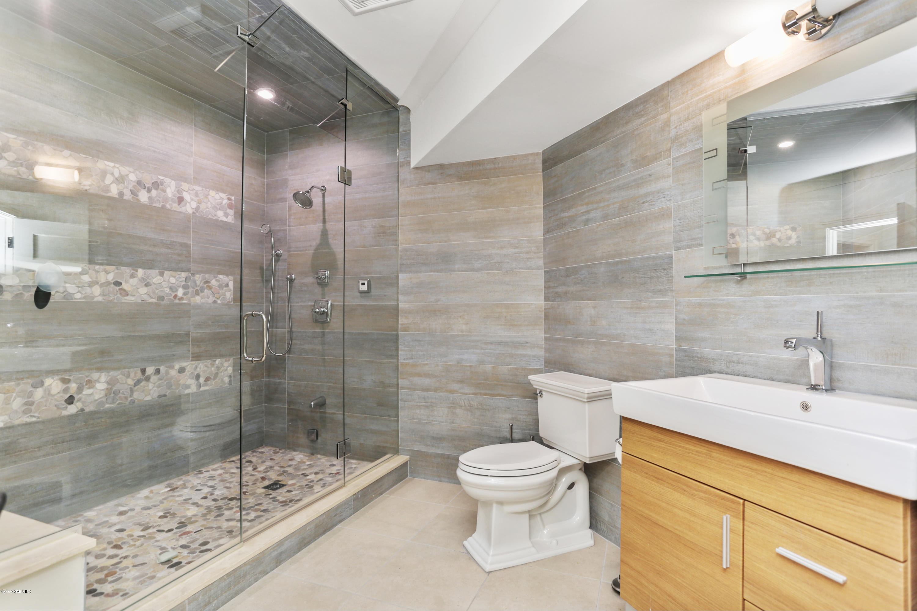 125 Cat Rock Road Cos Cob, CT 06807 - Photo 22 of 33 a bathroom with a sink a toilet and shower