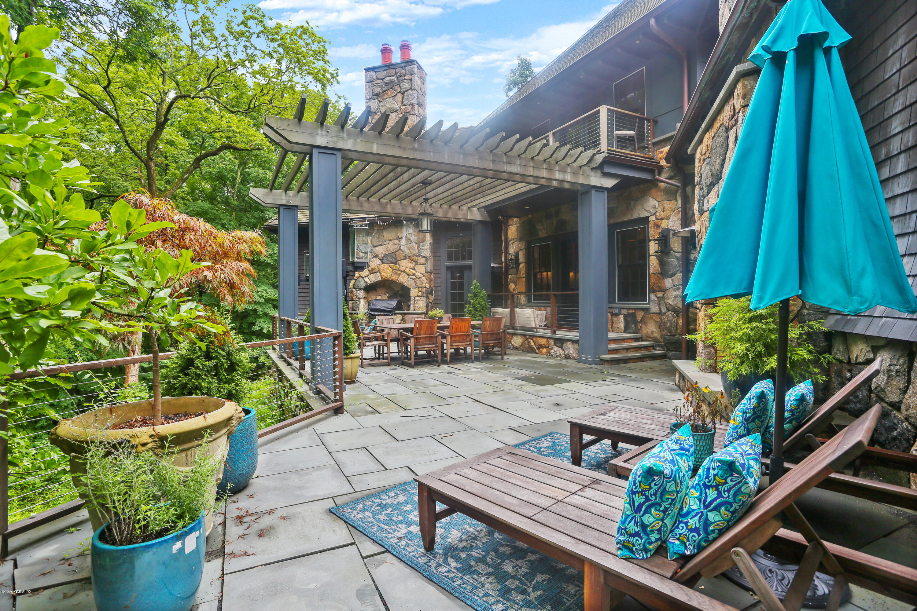 125 Cat Rock Road Cos Cob, CT 06807 - Photo 24 of 33 a view of an outdoor sitting area with a small yard