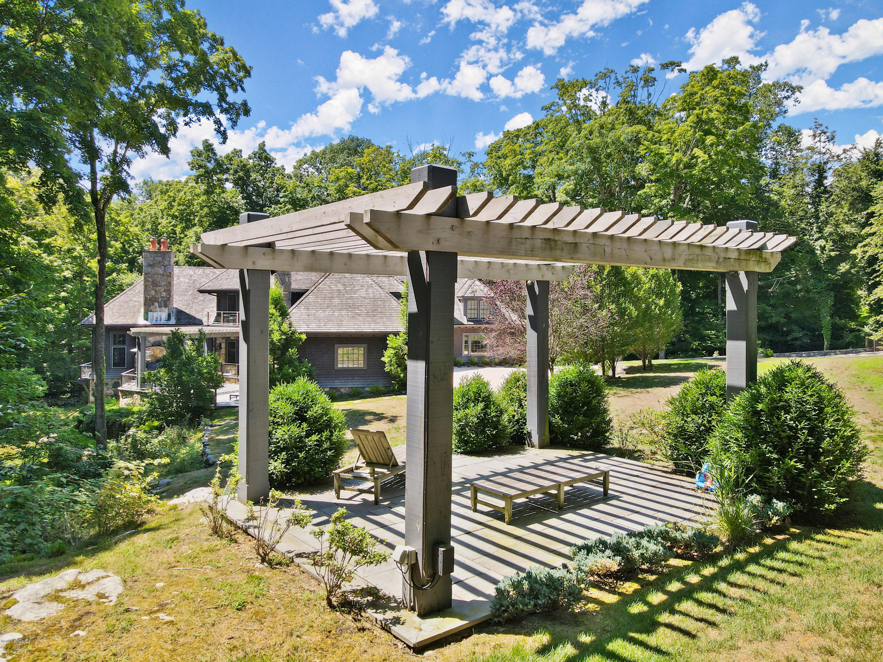 125 Cat Rock Road Cos Cob, CT 06807 - Photo 28 of 33 a view of a house with a yard
