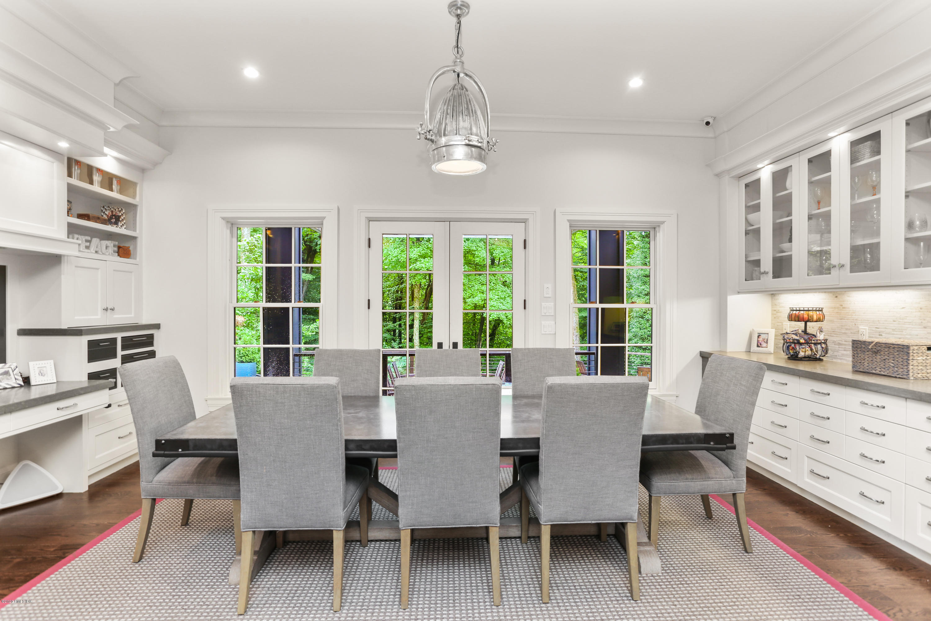 125 Cat Rock Road Cos Cob, CT 06807 - Photo 3 of 33 a view of a dining room with furniture large windows and wooden floor