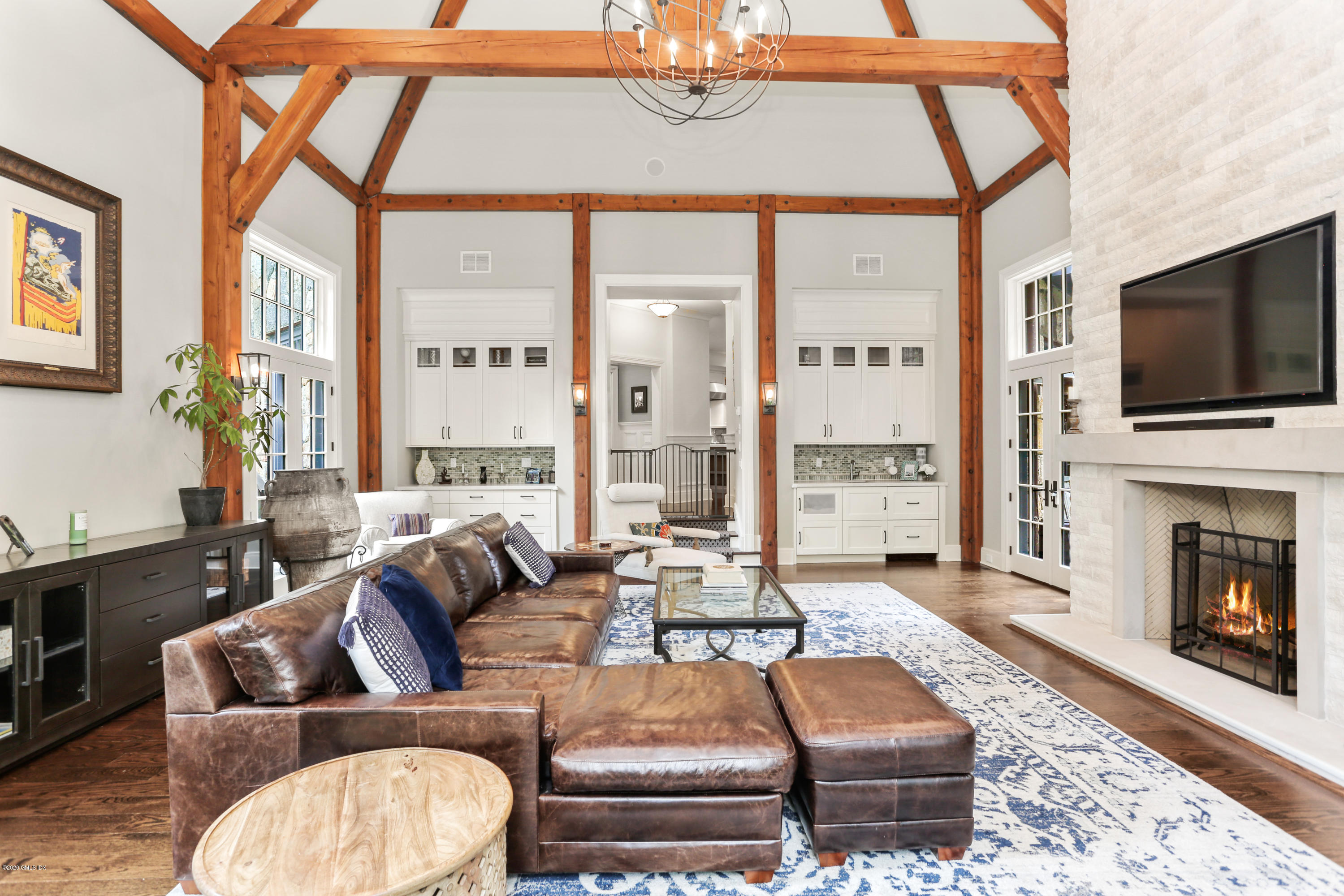 125 Cat Rock Road Cos Cob, CT 06807 - Photo 4 of 33 a living room with fireplace furniture and a flat screen tv