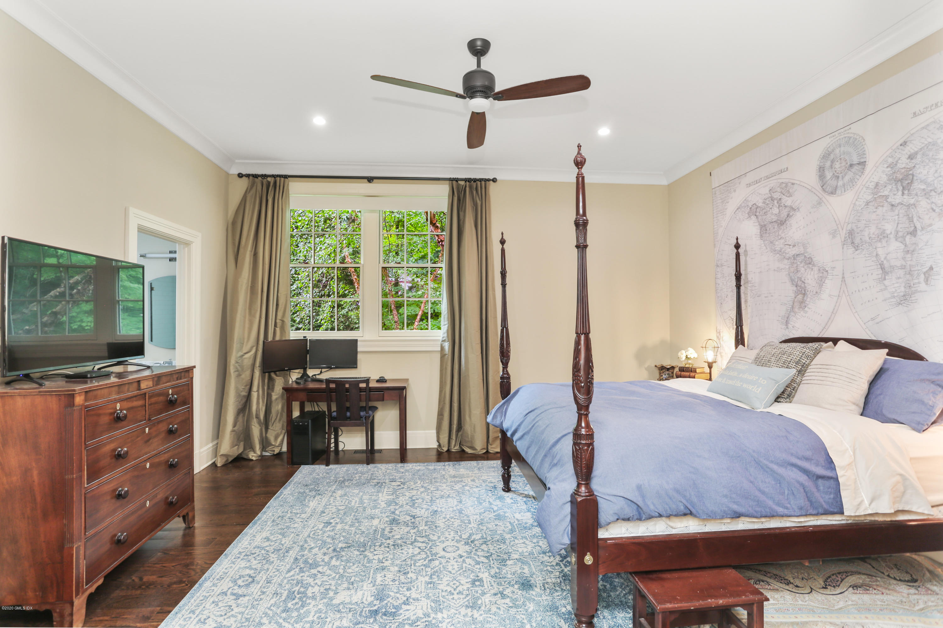 125 Cat Rock Road Cos Cob, CT 06807 - Photo 9 of 33 a bedroom with a bed and a flat screen tv