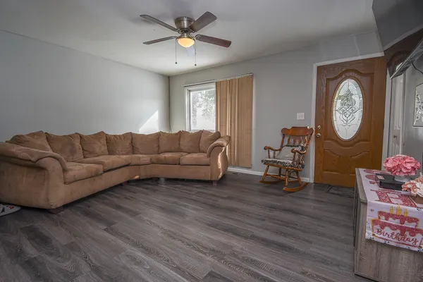 a living room with furniture and a window