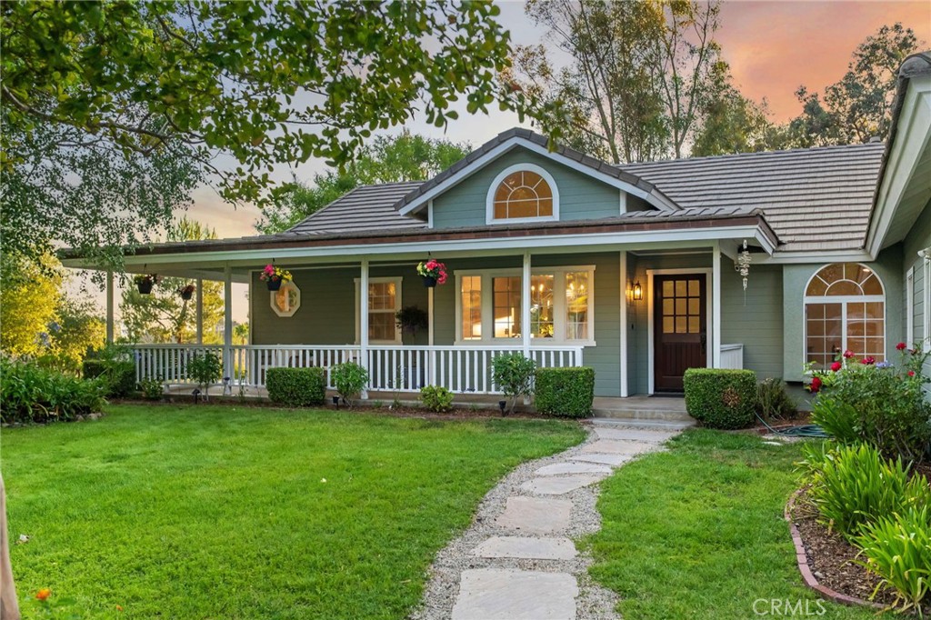 42333 Casa Verde Temecula, CA 92592 - Photo 1 of 44 a front view of a house with a yard and green space