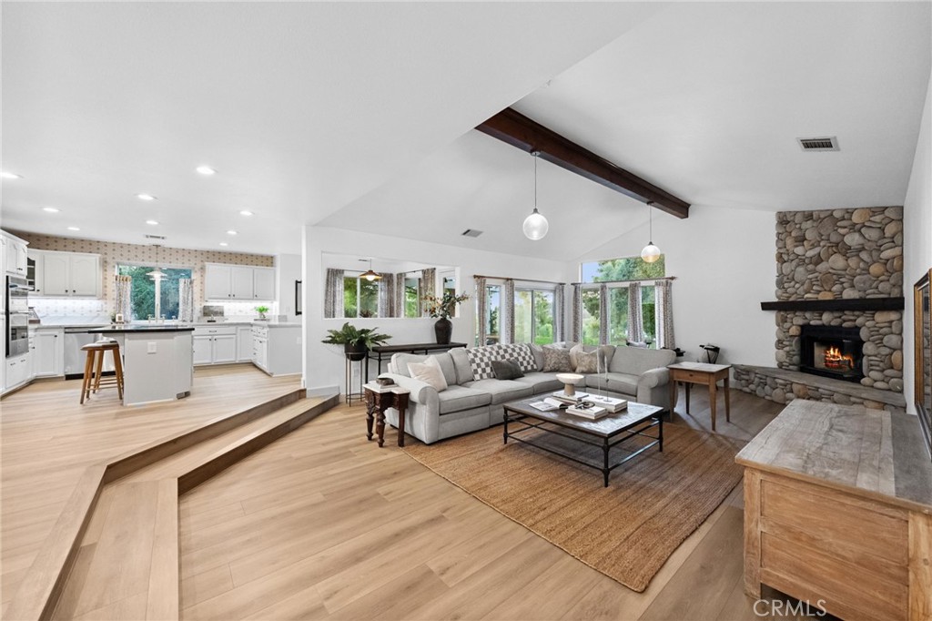 42333 Casa Verde Temecula, CA 92592 - Photo 12 of 44 a living room with furniture and a fireplace