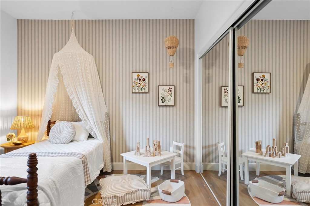 42333 Casa Verde Temecula, CA 92592 - Photo 23 of 44 a bedroom with a bed and a mirror