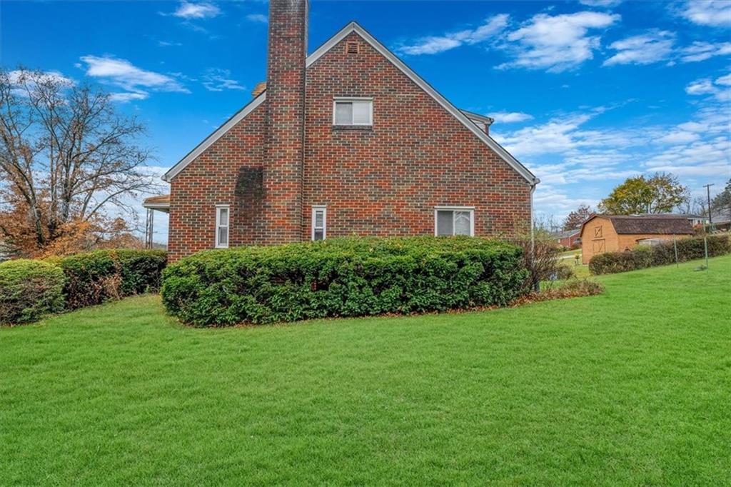 643 Agnew Road Pittsburgh, PA 15227 - Photo 40 of 49 a front view of a house with a yard