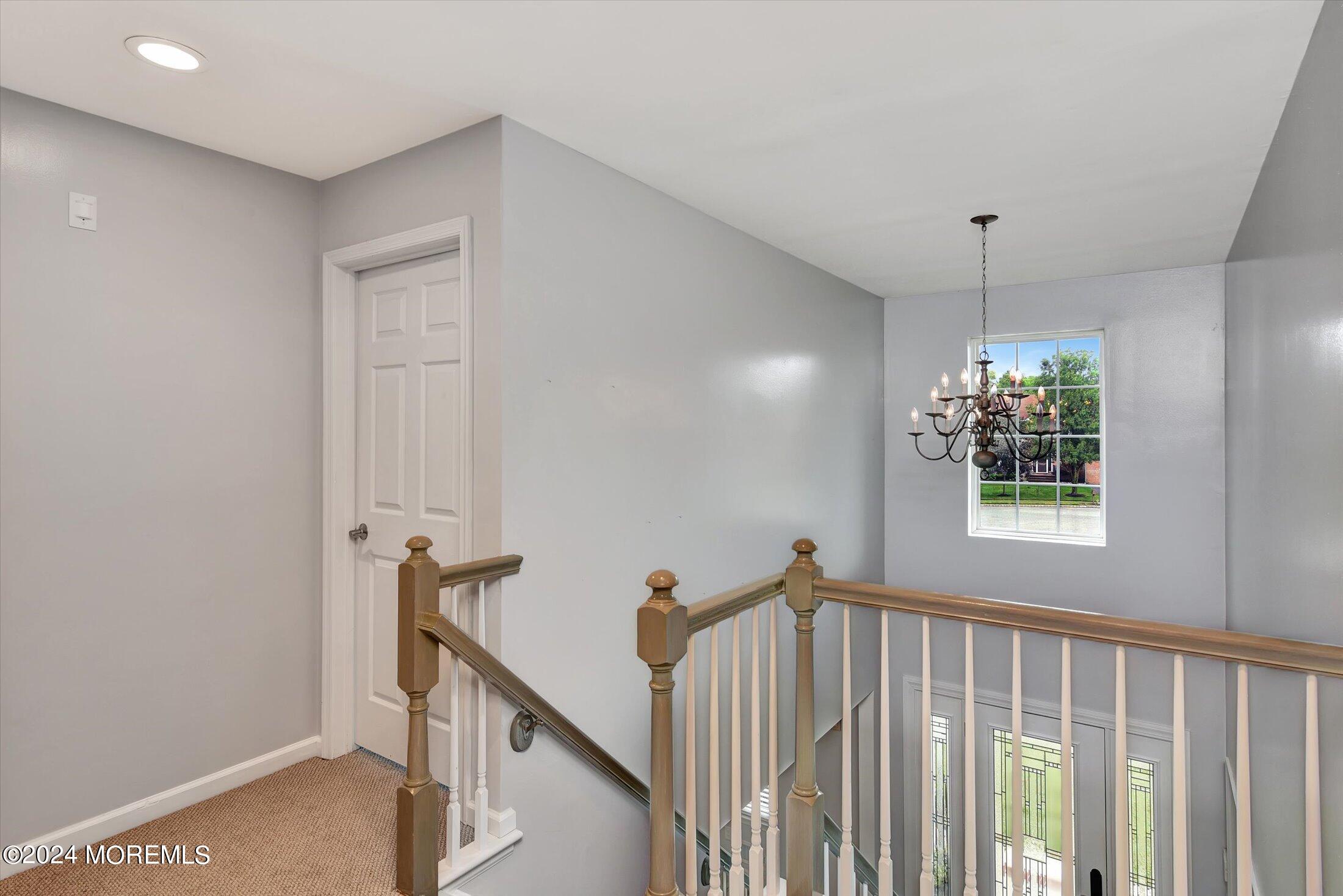 29 Nate Lane Howell, NJ 07731 - Photo 16 of 42 a view of a hallway with windows