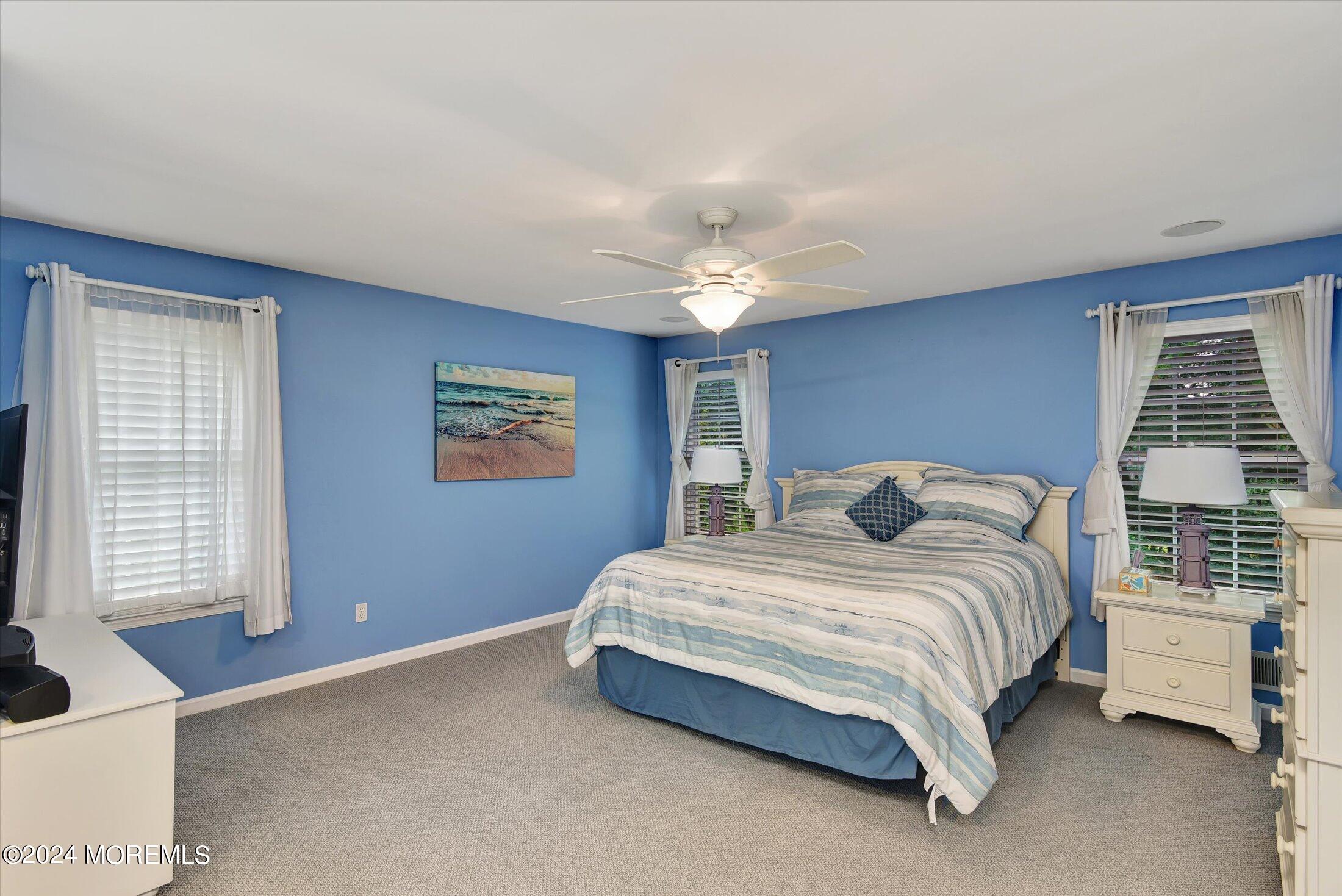 29 Nate Lane Howell, NJ 07731 - Photo 22 of 42 a bedroom with a bed and a window