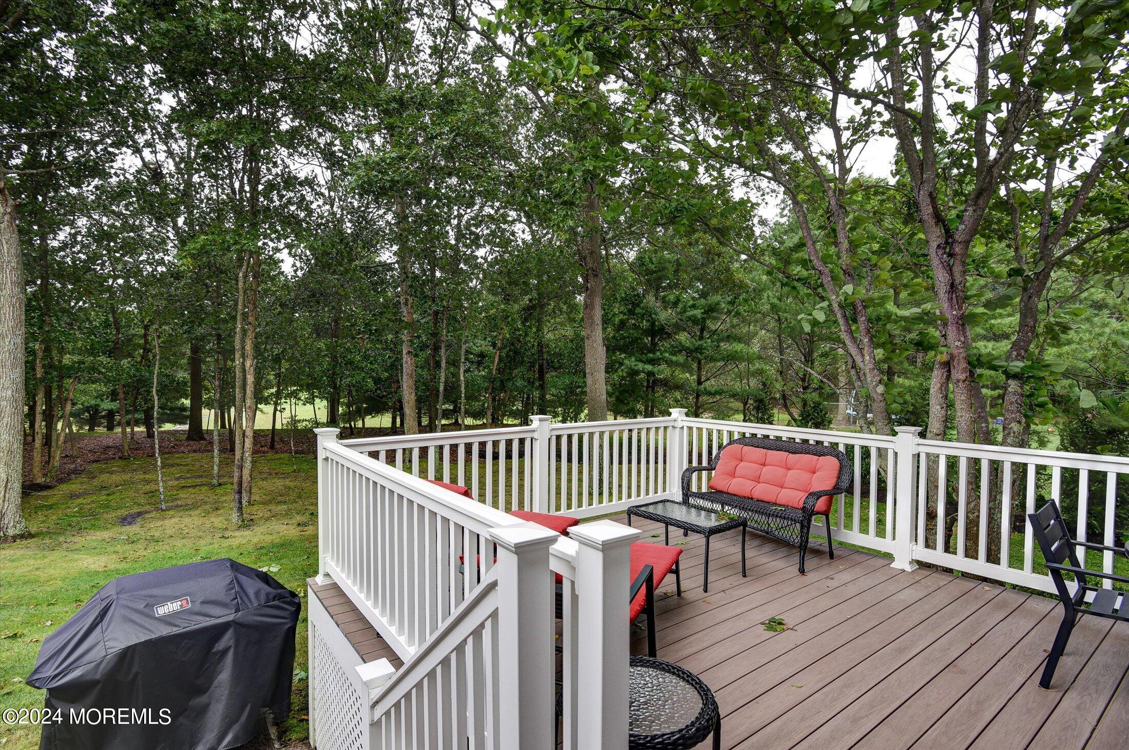 29 Nate Lane Howell, NJ 07731 - Photo 33 of 42 a view of a wooden deck with chairs