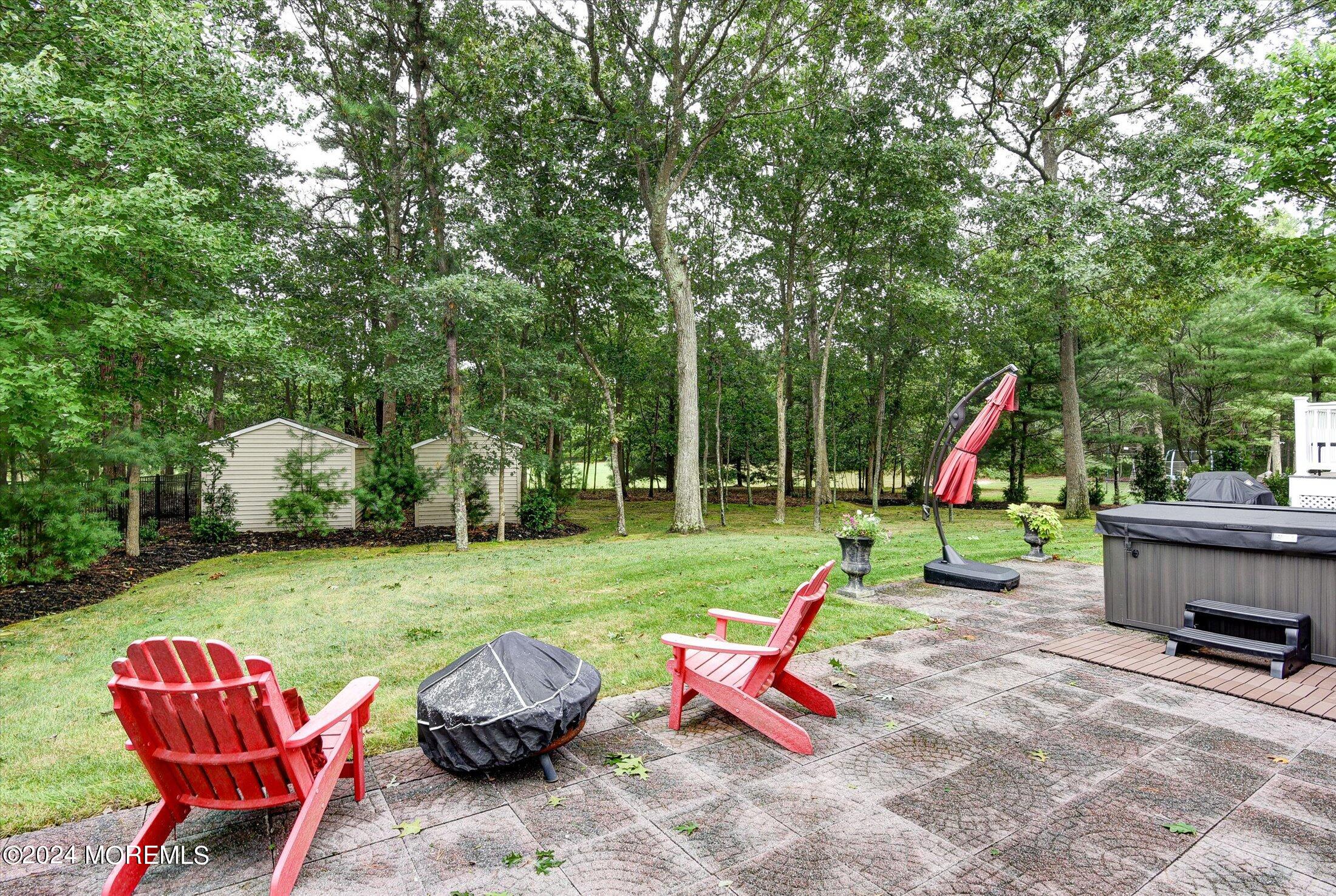 29 Nate Lane Howell, NJ 07731 - Photo 34 of 42 a view of backyard with swimming pool and outdoor seating