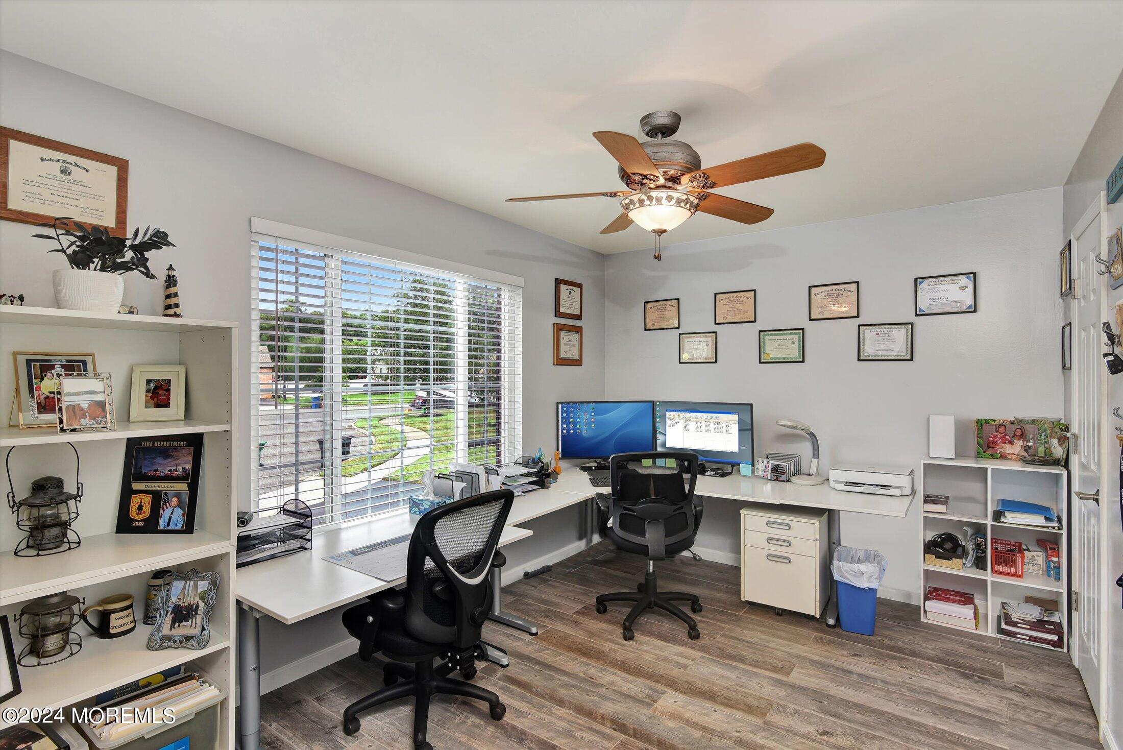 29 Nate Lane Howell, NJ 07731 - Photo 6 of 42 a view of a workspace with furniture and a window