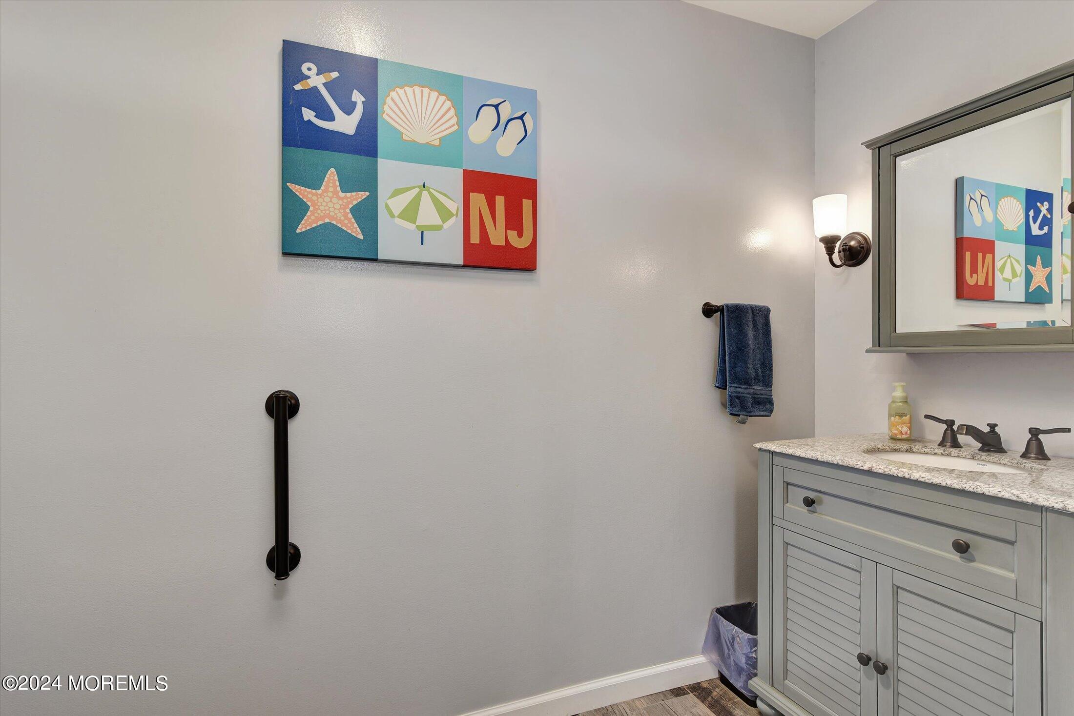 29 Nate Lane Howell, NJ 07731 - Photo 7 of 42 a bathroom with a sink and a mirror