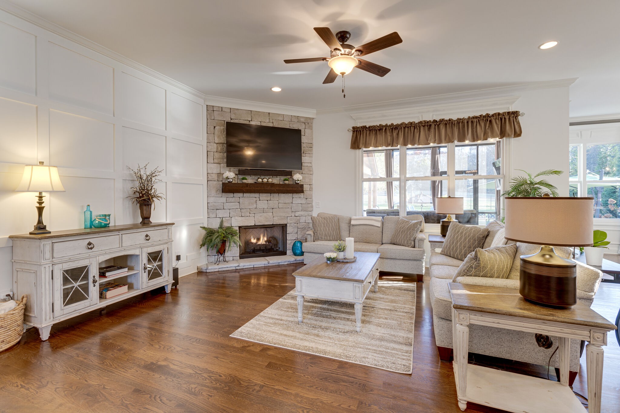 3692 Ronstadt Road Thompson's Station, TN 37179 - Photo 12 of 63 a living room with furniture a fireplace and a flat screen tv