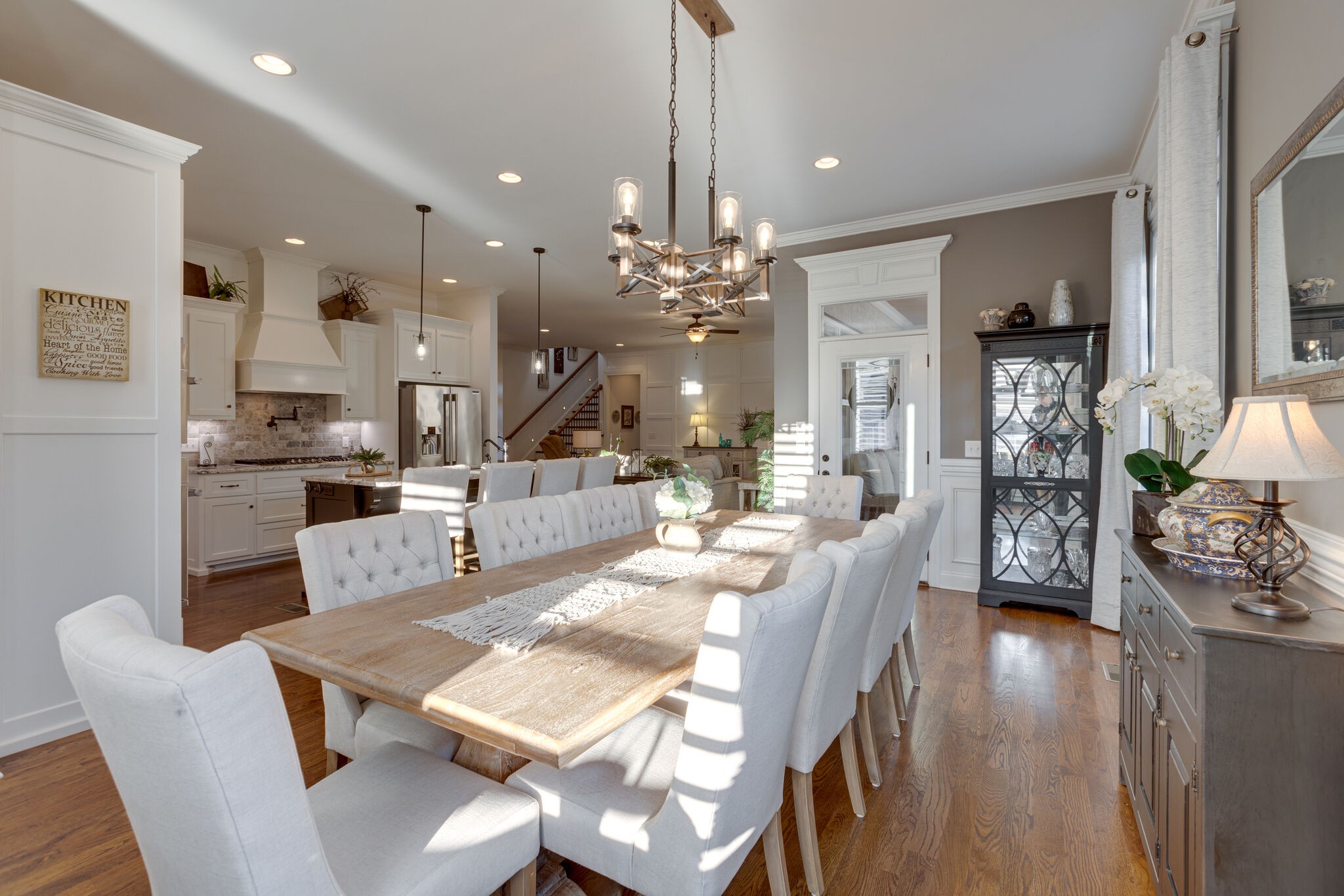 3692 Ronstadt Road Thompson's Station, TN 37179 - Photo 20 of 63 a view of a dining room and livingroom with furniture wooden floor a chandelier