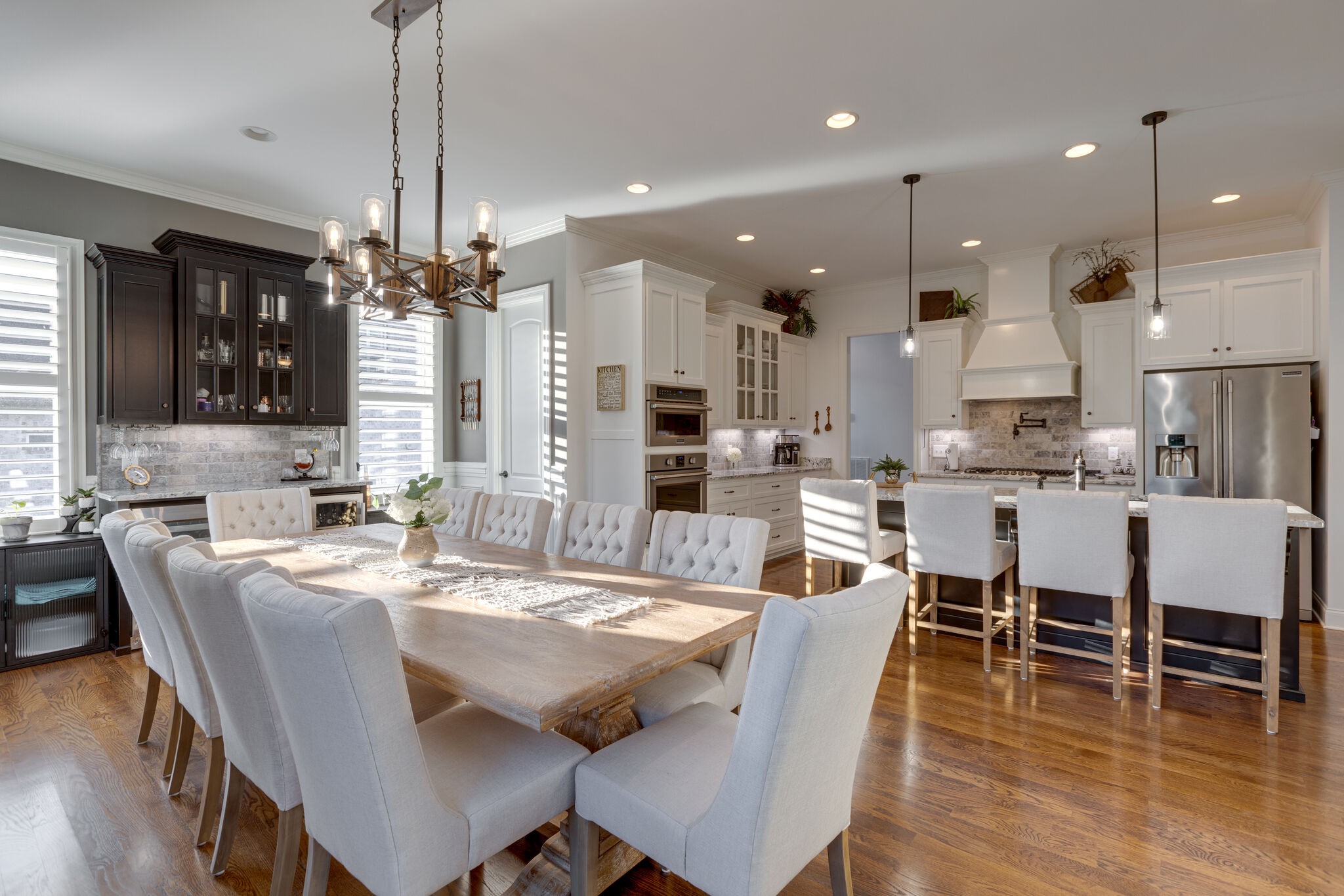 3692 Ronstadt Road Thompson's Station, TN 37179 - Photo 21 of 63 a view of a dining room and livingroom with furniture wooden floor a chandelier